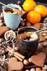Cup of tea, apple, spices, nuts and  cookies