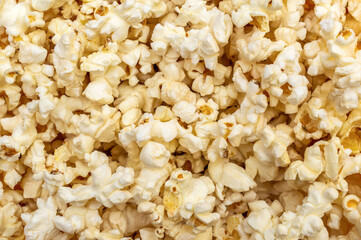 Popcorn background. Scattered popcorn. Close up. Abstract background.