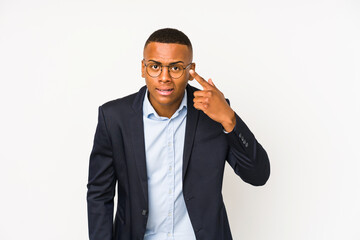 Young business latin man isolated on white background showing a disappointment gesture with...