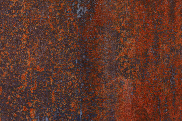 Red-orange coating on metal, rust, old rusty iron, surface, dark. Background, texture.