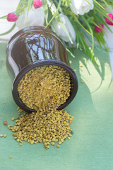 Bee pollen. A valuable and useful beekeeping product and a natural antiseptic. Closeup. Blurred. Vertical orientation.