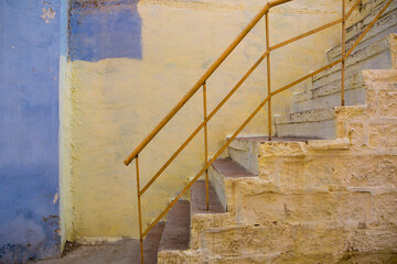 Beautiful old building. Steps near the wall. Indian travel. Blue streets in Rajasthan. Jodhpur, blue city.