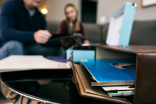 Home: Stack Of Records With Parent And Child Behind