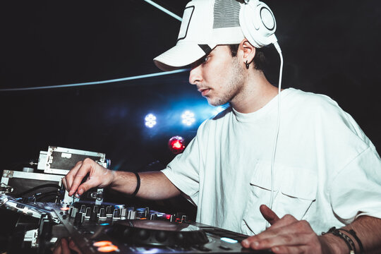professional DJ music mixer at a party at an electronic music concert