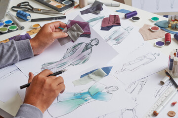 Fashion designer sketching costume design