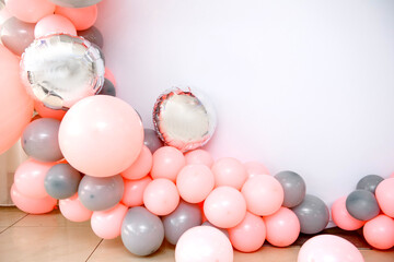 Close up the photo zone from pink and grey balloons with white copy space for your text.