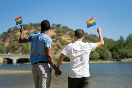 gay couple enjoying a day on the river