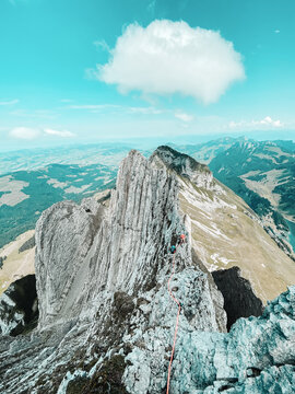 Female Climbers climbing on narrow ridge in Switzerland