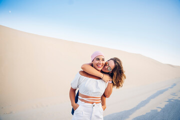 Young woman with pink headscarf fighting cancer together with her friend.