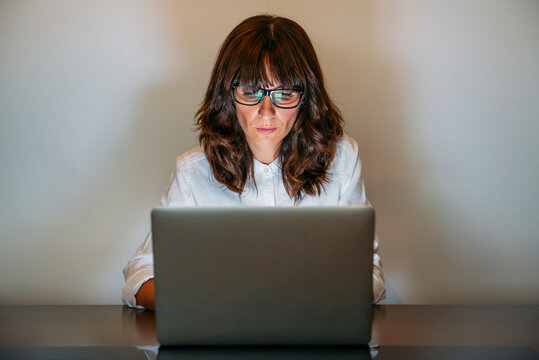 Female secretary works with computer