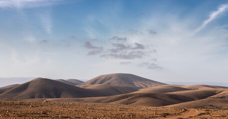 Fototapeta na wymiar desert landscape with volcanic mountains in Fuerteventura, Canary Islands - trekking landscape 