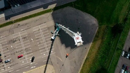 The tallest and largest mobile truck crane with extended boom. Aerial top view.