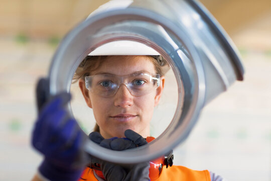 Young woman working in a workshop as artisan manual worker
