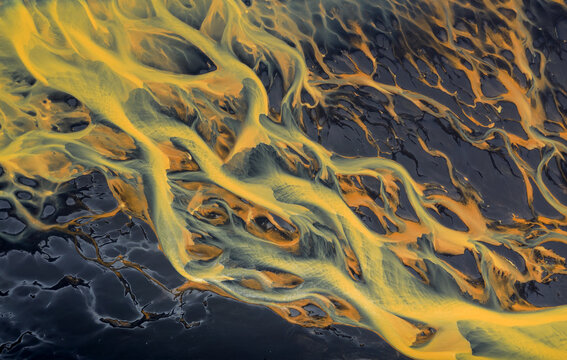 Colorful glacier rivers on the south coast of Iceland with black sand
