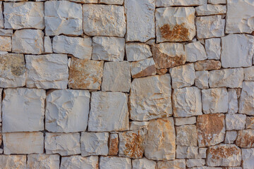 Close-up of stone wall laid dry, without cement. Typical of the Italian countryside. Available in various sizes.