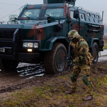 modern soldier moves undercover armored car