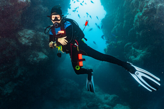 diver exploring cave at the great Barrier Reef
