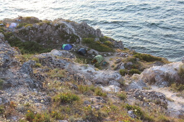 Fototapeta na wymiar Dzhangul shore with a tent camp. Tarkhankut. Western Crimea