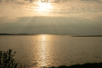 Naklejka premium sunset over the river
