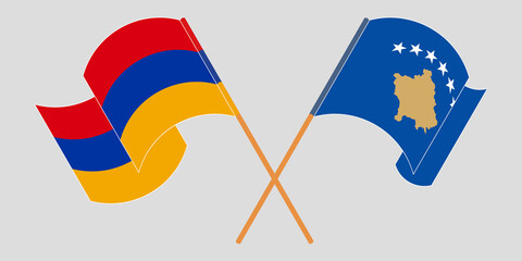 Crossed and waving flags of Kosovo and Armenia