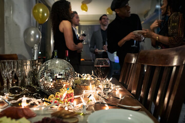 NYE: Focus On Disco Ball On Table With Party Favors