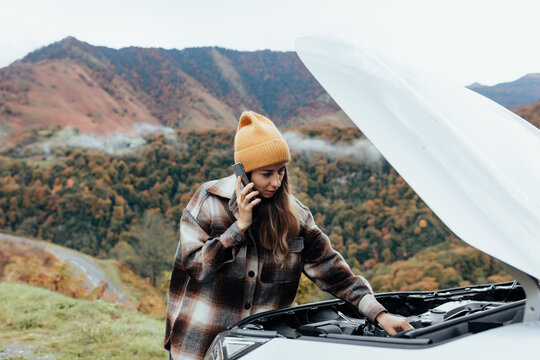 woman rearing her broken car