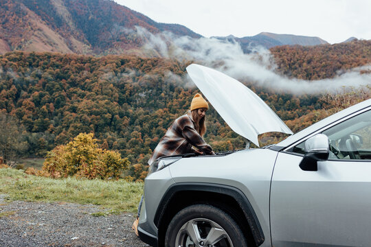 woman rearing her broken car