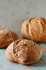 Homemade Freshly Baked Country Bread  made from wheat and whole grain flour on gray background. French Freshly baked bread. 