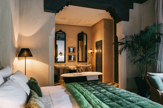 Quaint Bedroom With Attached Bathroom and Bathtub