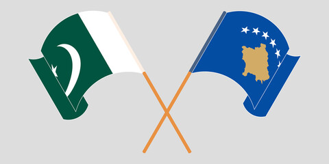 Crossed and waving flags of Kosovo and Pakistan