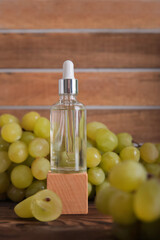 Cold pressed grape oil. Organic bio care products with natural ingredients. Close-up grapes and copy space. Halved grapes and grape seeds.