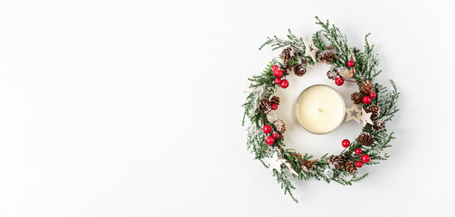 Top view of traditional Christmas wreath and candle