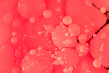 Swirling light red neon colors, looking like grapefruit juice