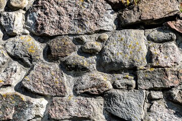 Abstract drawing of granite stones on the wall of the old fortress.
