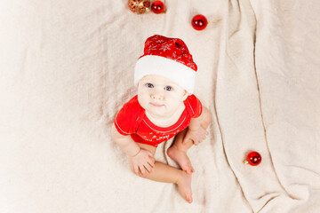 small child, baby lies on his stomach and smiles. On a white background. Newborn baby. three months old baby. A baby of European appearance. selective focus