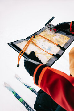 Anonymous Skier Using Map and Compass