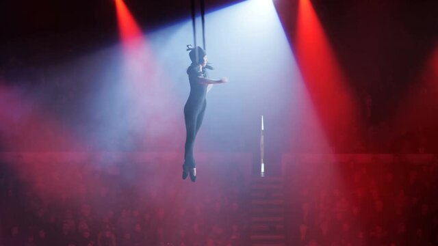 Aerialist on canvases in circus