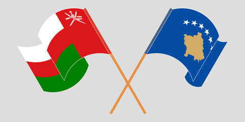 Crossed and waving flags of Kosovo and Oman