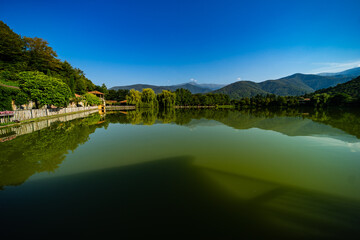 Fototapeta premium Lopota lake with reflection of mountains