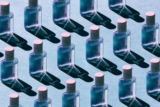 Pattern Of Hand Sanitizer Bottles On Blue