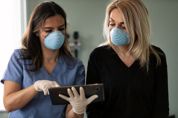 Exam: Doctor Uses Digital Tablet To Inform Patient