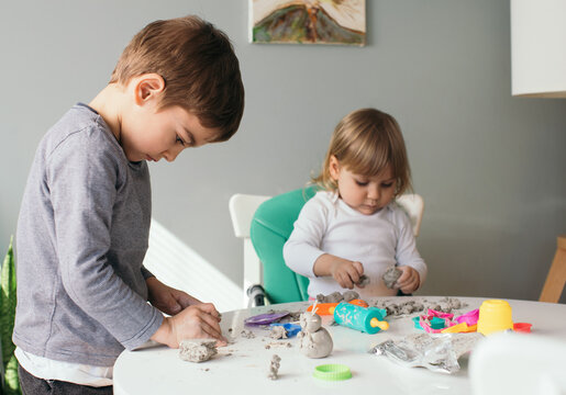 Siblings Playing with Modeling Clay at Home