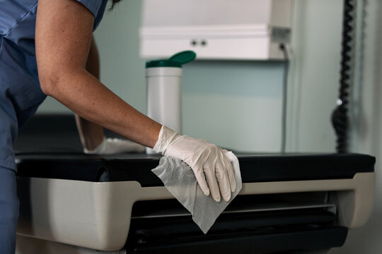 Exam: Anonymous Nurse Sanitizes Exam Table