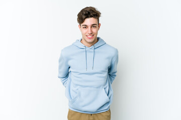 Fototapeta premium Young caucasian man isolated on white background happy, smiling and cheerful.