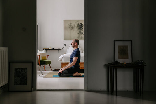 Man Doing Online Meditation Class At Home