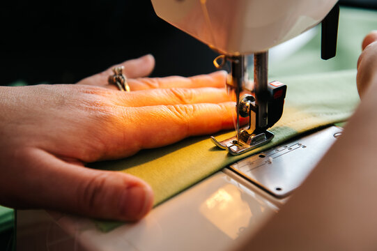 Woman sewing cloth face masks for friends and family