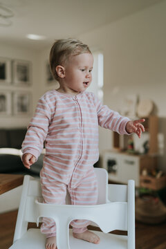 Adorable little baby girl pointing to the side