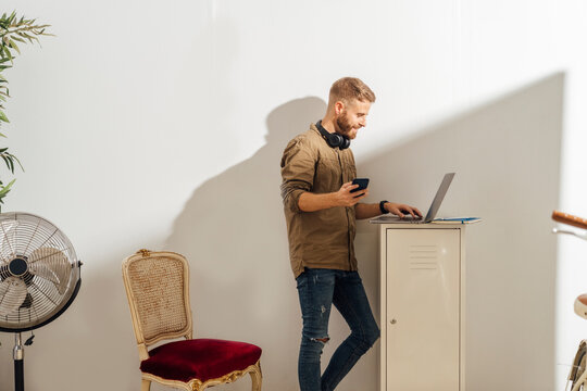 Man Using a Laptop Home