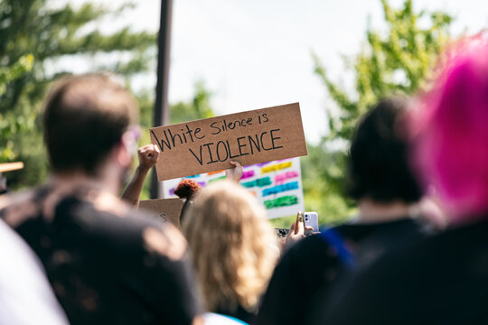 BLM: Anonymous Person Holds Up White Silence Sign