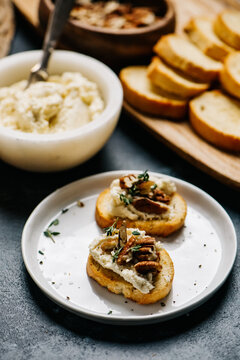 Crostini with honey whipped goat cheese and pecans